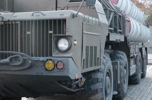 Close up of green military truck. Modern military transportation vehicle technologies photo