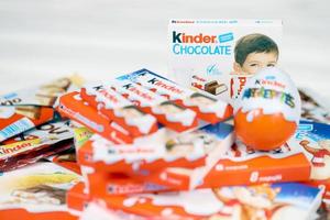 KHARKIV, UKRAINE - FEBRUARY 14, 2022 Kinder Chocolate various production. Kinder is a confectionery product brand line of multinational confectionery Ferrero. photo