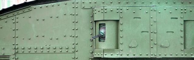 Abstract green industrial metal textured background with rivets and bolts photo