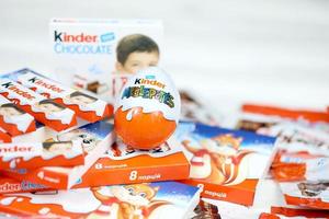 KHARKIV, UKRAINE - FEBRUARY 14, 2022 Kinder Chocolate various production. Kinder is a confectionery product brand line of multinational confectionery Ferrero. photo