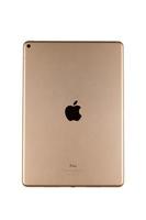 KHARKIV, UKRAINE - JANUARY 27, 2022 Brand new Apple iPad golden body surface with company logo on white background. Apple Inc. is an American technology company photo