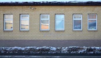 Brick wall with windows photo