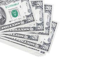 20 US dollars bills lies in small bunch or pack isolated on white. Mockup with copy space. Business and currency exchange photo