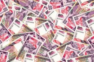 20 Sri Lankan rupees bills lies in big pile. Rich life conceptual background