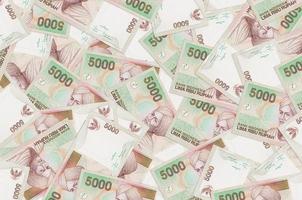 5000 Indonesian rupiah bills lies in big pile. Rich life conceptual background photo