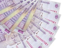 50000 Romanian leu bills lies isolated on white background with copy space stacked in fan shape close up photo