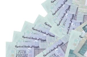 5 Egyptian pounds bills lies in different order isolated on white. Local banking or money making concept photo