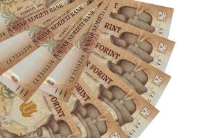 2000 Hungarian forint bills lies isolated on white background with copy space stacked in fan shape close up photo