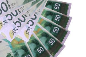50 Israeli new shekels bills lies isolated on white background with copy space stacked in fan shape close up photo