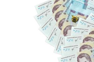 1000 Ukrainian hryvnias bills lies isolated on white background with copy space. Rich life conceptual background photo