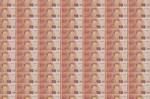 10 euro bills printed in money production conveyor. Collage of many bills. Concept of currency devaluation photo