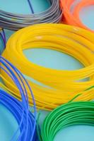 Plastic PLA and ABS filament material for printing on a 3D pen or printer of various colors photo