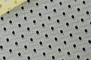 Yellow mesh sport wear fabric textile background pattern photo