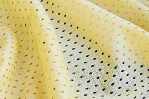 Yellow mesh sport wear fabric textile background pattern photo