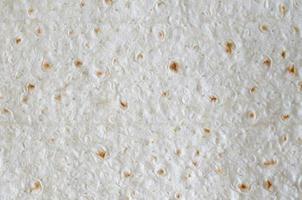 Homemade flat pita bread Turkish lavash background texture top view photo