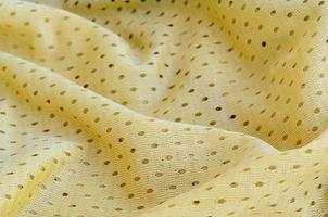 Yellow mesh sport wear fabric textile background pattern photo