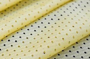 Yellow mesh sport wear fabric textile background pattern photo