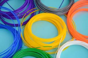 Plastic PLA and ABS filament material for printing on a 3D pen or printer of various colors photo