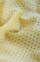 Yellow mesh sport wear fabric textile background pattern photo