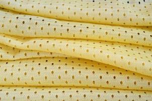 Yellow mesh sport wear fabric textile background pattern photo