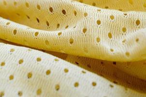 Yellow mesh sport wear fabric textile background pattern photo