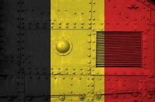Belgium flag depicted on side part of military armored tank closeup. Army forces conceptual background photo