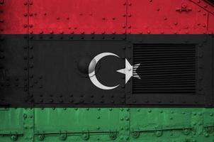 Libya flag depicted on side part of military armored tank closeup. Army forces conceptual background photo