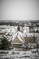 A panoramic view of Petrovaradin rooftops covered with snow photo