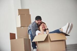 Going forward. Happy couple together in their new house. Conception of moving photo