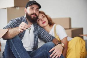 We are independent now. Happy couple together in their new house. Conception of moving photo