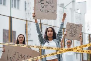 You can't silence us. Group of feminist women have protest for their rights outdoors photo