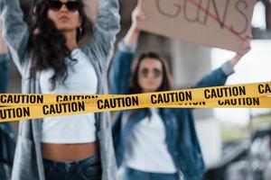 Don't surrender. Group of feminist women have protest for their rights outdoors photo