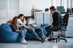 This might be interesting information. Group of young people in casual clothes working in the modern office photo