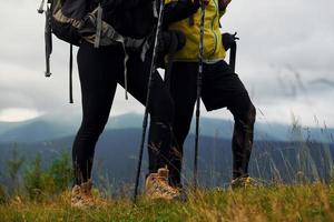 Hiking together. Woman and man. Majestic Carpathian Mountains. Beautiful landscape of untouched nature photo