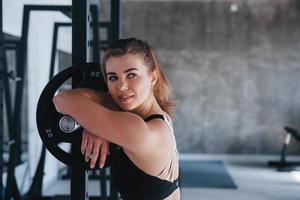 Attractive young girl. Photo of gorgeous blonde woman in the gym at her weekend time