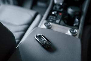 Illuminated by daylight that comes from the window. Close up view of interior of brand new modern luxury automobile photo