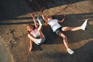 Having fun and lying down wooden ramp. Summertime happiness photo