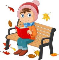 Cartoon little boy sitting at bench with reading a book vector