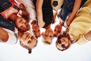 Portrait of kids that standing together and posing for the camera photo