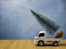 The  Christmas tree on truck for holiday concept photo