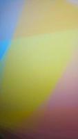 Smooth and blurry colorful gradient mesh background. Purple, yellow, green and black. photo