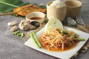 Papaya Salad, Thai food that is spicy, sour, is a dish in the northeast of Thailand. photo