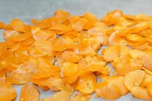 Raw yellow crackers ready to be cooked on a concrete background photo