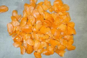 Raw yellow crackers ready to be cooked on a concrete background photo