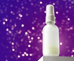 bottle with enzyme peeling solution, two phase treatment serum with fermented cosmetic product. hero anlge of view, christmas gift, cosmetic mockup with bokeh lights. photo