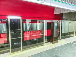 subway tunnel. lines for trains. subway cars are protected by plastic doors for the safety of passengers. modern metro station photo