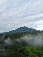 mountain view from below with beautiful light mist photo