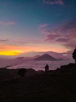 golden sunrise prau mountain with beautiful sky sea of clouds morning photo