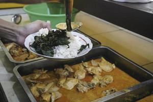 A portrait of Indonesian food called nasi padang photo