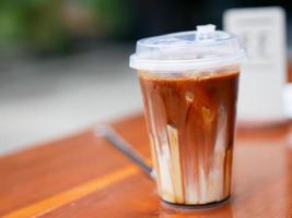 fresh brown sugar coffee drink in a transparent plastic cup photo